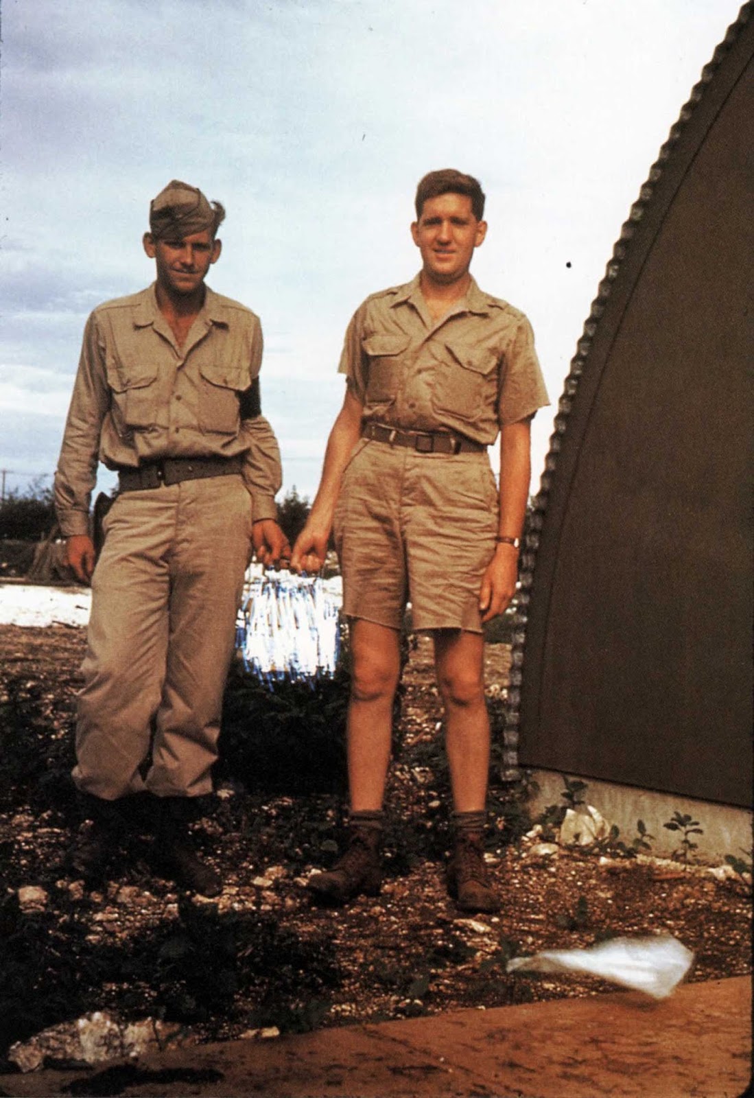 Another photo of Harold Agnew holding the Nagasaki atomic bomb core, only this time the atomic bomb is redacted by the FBI.