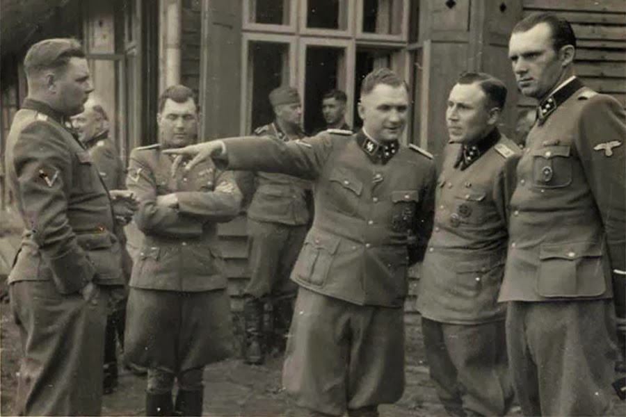 A group photo of the mass murderers of Auschwitz: Josef Kramer, Josef Mengele, Richard Baer, Karl Höcker (from left; man at right unidentified).