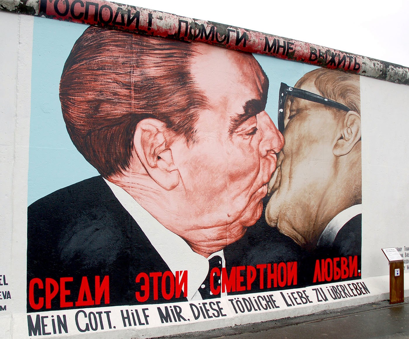 Soviet President Leonid Brezhnev and East German leader Erich Honecker change kisses after Brezhnev was honored with the title