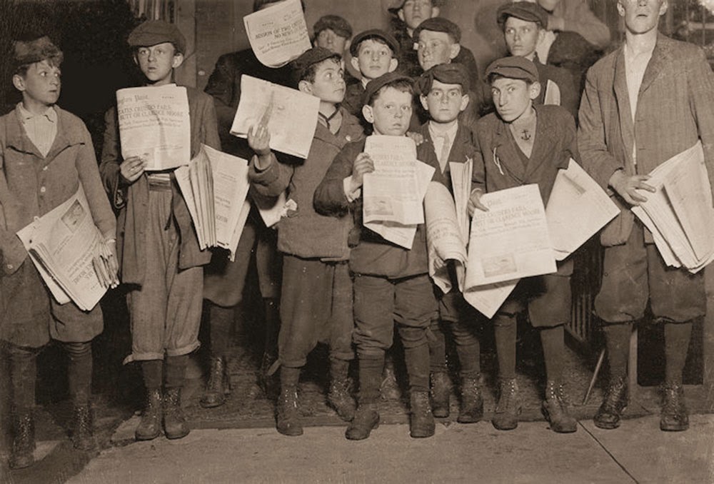 Out after midnight selling extras. There were many young boys selling very late. Youngest boy in the group is 9 years old. Harry, age 11, Eugene and the rest were a little older. Washington, D.C
