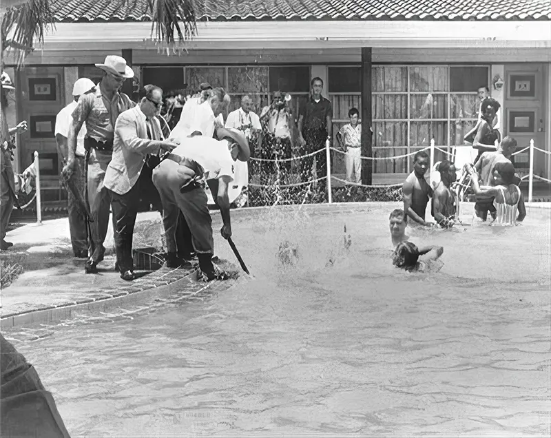 Motel manager pouring acid in the water when black people swam in his pool