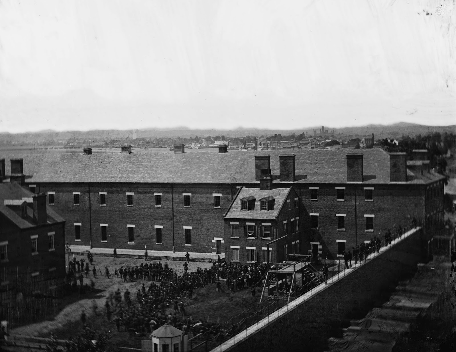 The scaffold in use and the crowd in the yard seen from the roof of the Washington Arsenal.