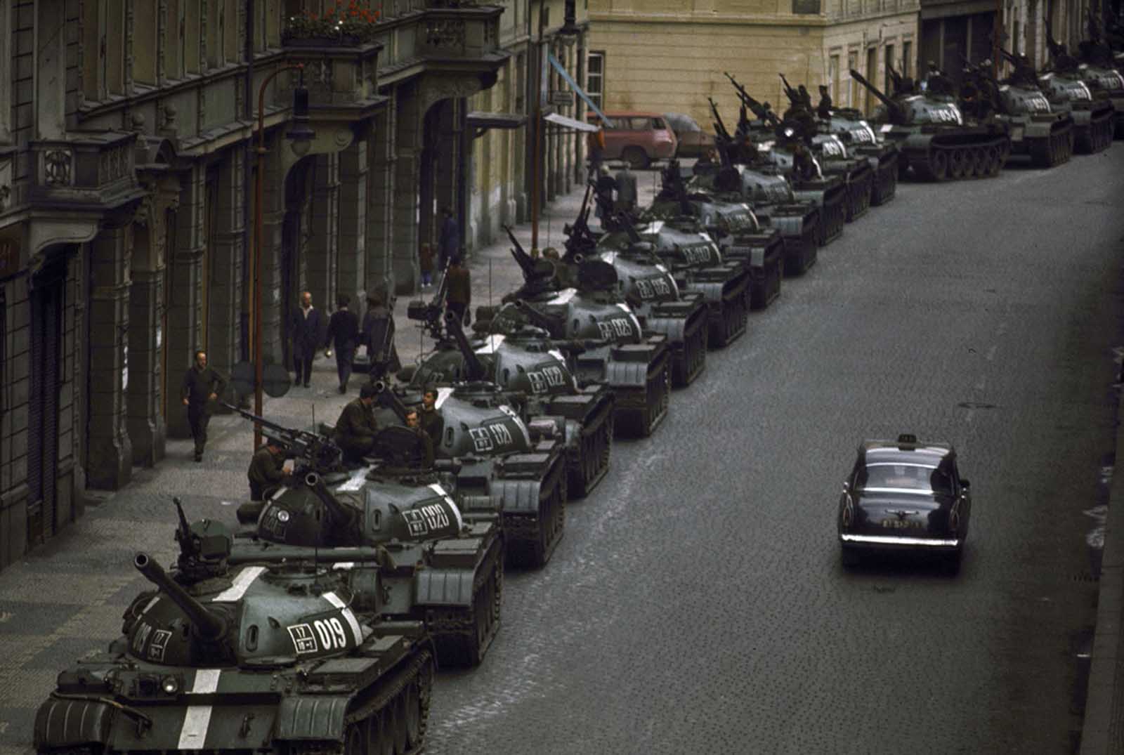A lone car passes dozens of Soviet tanks during the 1968 invasion of Czechoslovakia.