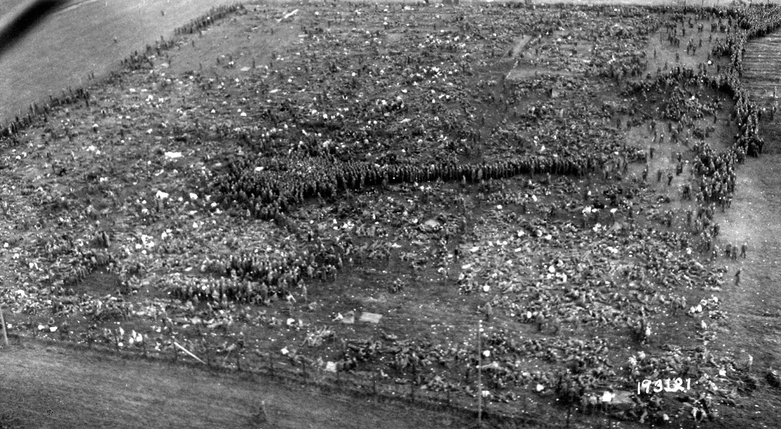 Just some of the tens of thousands of POW's captured after the collapse of the Faliase Pocket are seen from the air Nonant le Pin POW camp.