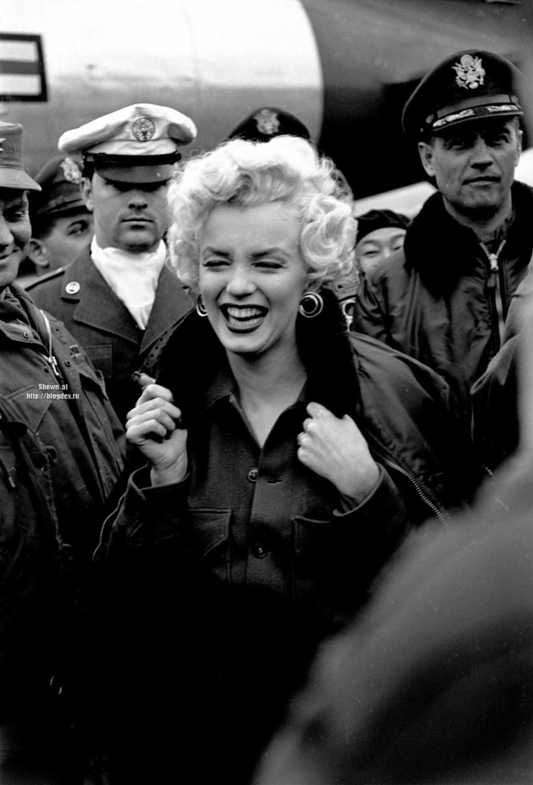 Marilyn Monroe received an escort while in Korea for her USO tour.