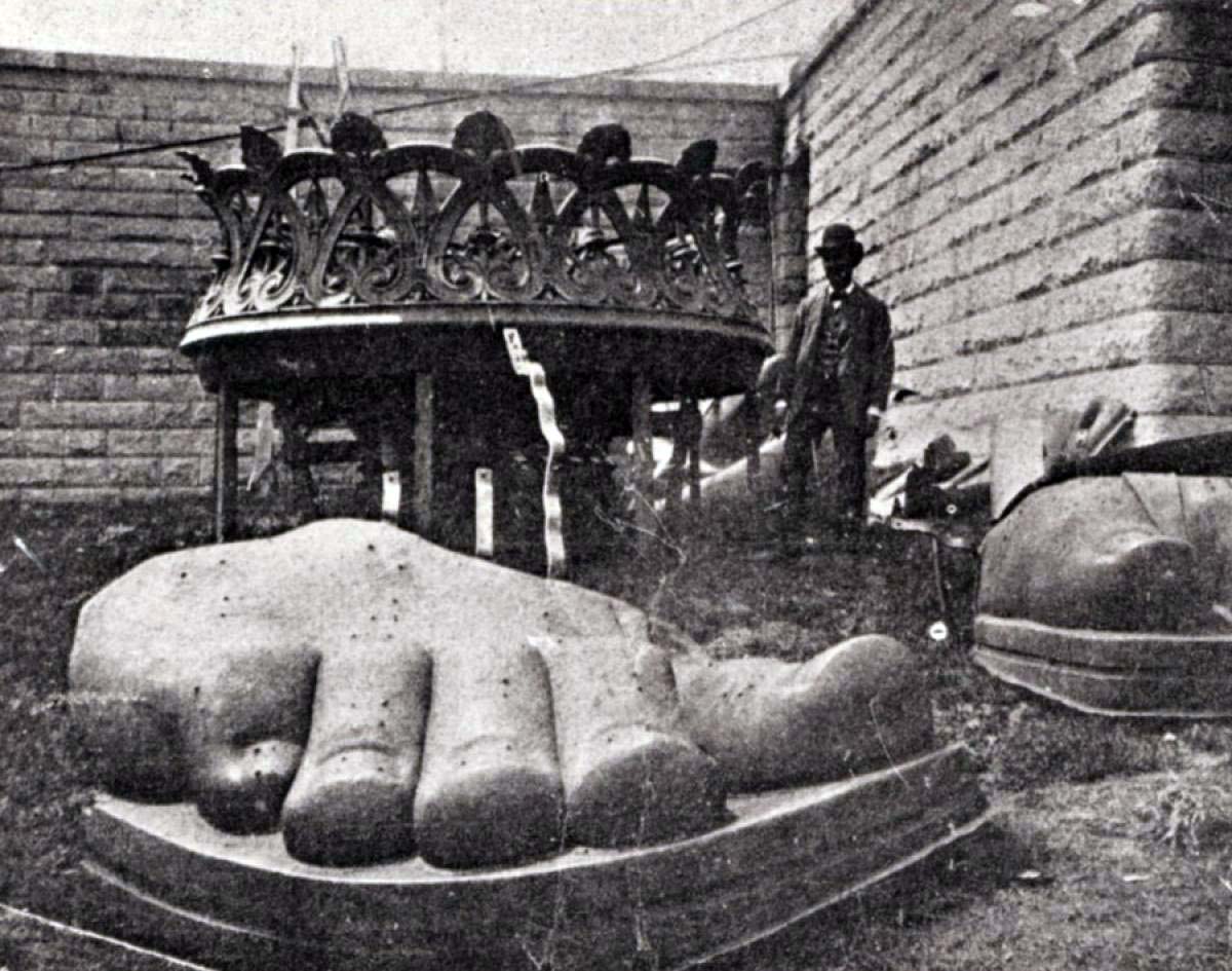 The Statue of Liberty's limbs and crown arrived piecemeal before they were constructed together into Lady Liberty. They're seen being uncrated here on Liberty Island in 1885.