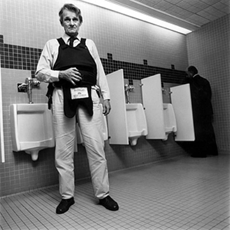 In any event he put on his ill-fitting bullet-proof vest and flew to the job once a week.