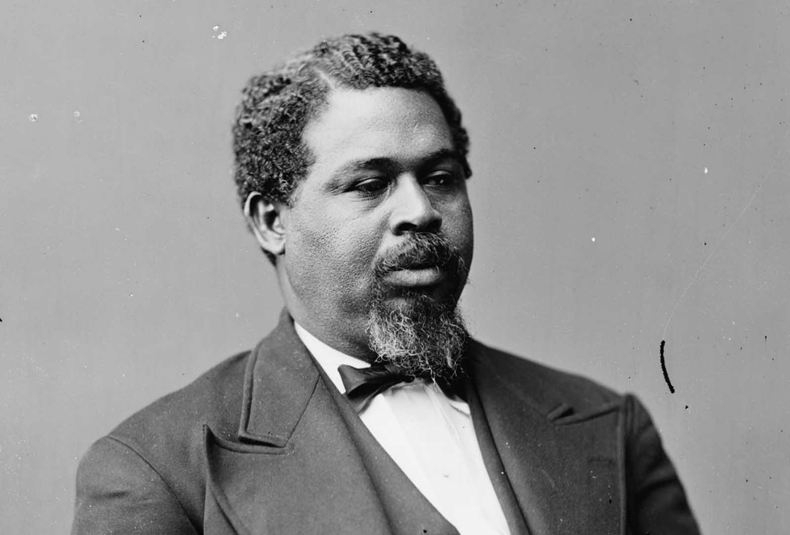 Robert Smalls was born a slave in South Carolina. During the Civil War, Smalls steered the CSS Planter, an armed Confederate military transport. On May 12, 1862, the Planter's three white officers decided to spend the night ashore. About 3 am, Smalls and seven of the eight enslaved crewmen decided to make a run for the Union vessels that formed the blockade, as they had earlier planned. Smalls dressed in the captain's uniform and had a straw hat similar to that of the white captain. The Planter stopped at a nearby wharf to pick up Smalls' family and the relatives of other crewmen, then they sailed toward Union lines, with a white sheet as a flag. After the war, he went on to serve in the United States House of Representatives, representing South Carolina.