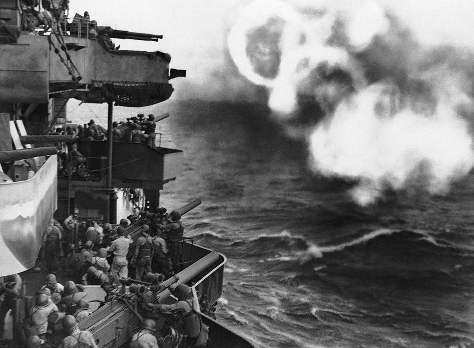 Secondary batteries of an American cruiser formed this pattern of smoke rings as guns from the warship blasted at the Japanese on Makin Island in the Gilberts before U.S. forces invaded the atoll on November 20, 1943.
