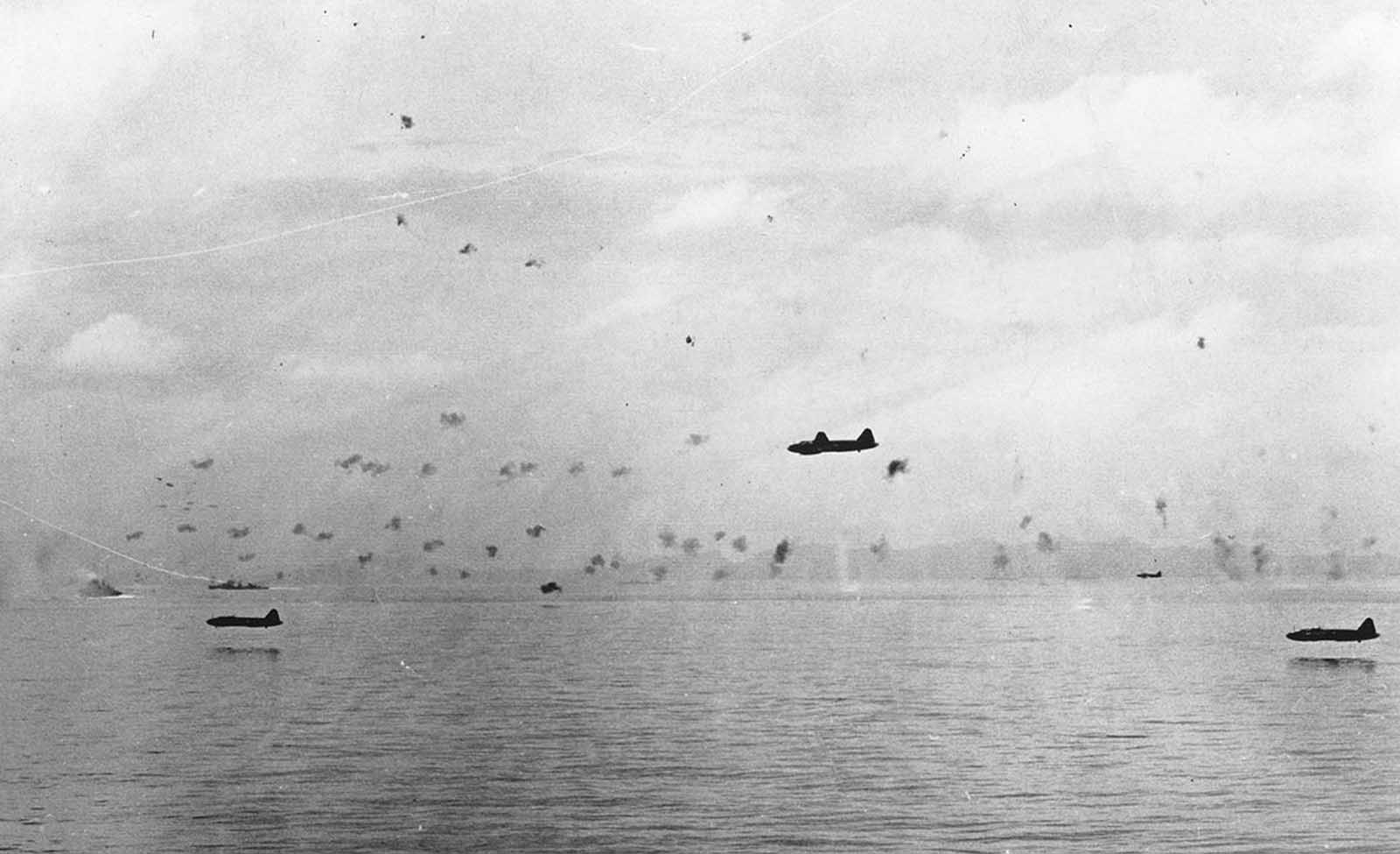 Japanese bomber planes sweep in very low for an attack on U.S. warships and transporters, on September 25, 1942, at an unknown location in the Pacific Ocean.
