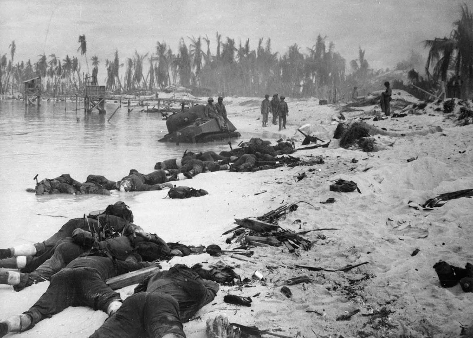 Sprawled bodies of American soldiers on the beach of Tarawa atoll testify to the ferocity of the battle for this stretch of sand during the U.S. invasion of the Gilbert Islands, in late November 1943. During the 3-day Battle of Tarawa, some 1,000 U.S. Marines died, and another 687 U.S. Navy sailors lost their lives when the USS Liscome Bay was sunk by a Japanese torpedo.