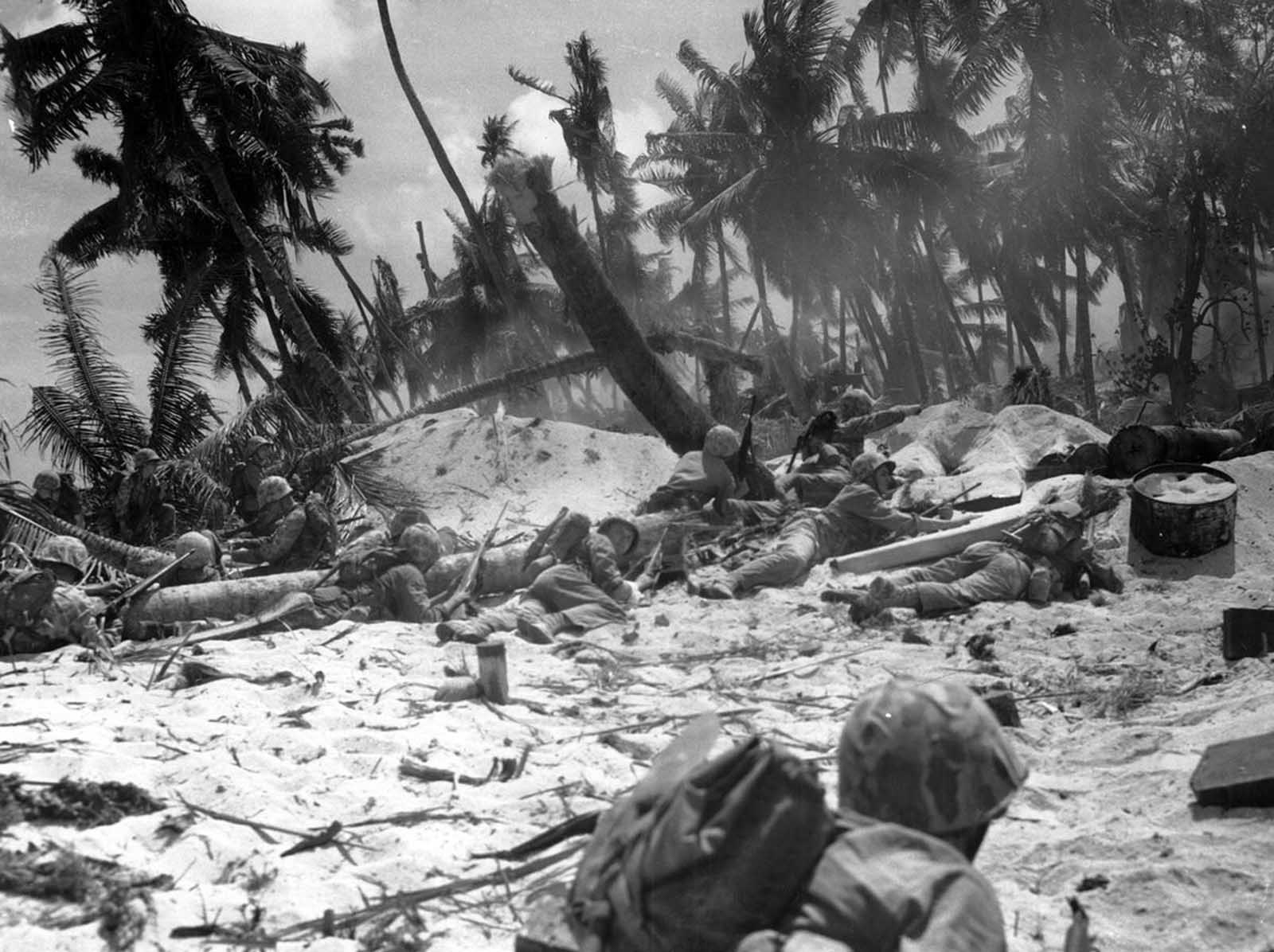 U.S. Marines are seen as they advance against Japanese positions during the invasion at Tarawa atoll, Gilbert Islands, in this late November 1943 photo. Of the nearly 5,000 Japanese soldiers and workers on the island, only 146 were captured, the rest were killed.