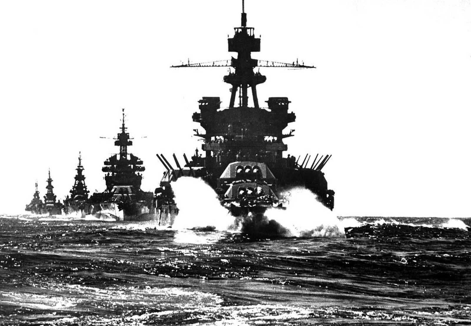 The battleship USS Pennsylvania, followed by three cruisers, moves in line into Lingayen Gulf preceding the landing on Luzon, in the Philippines, in January of 1945.