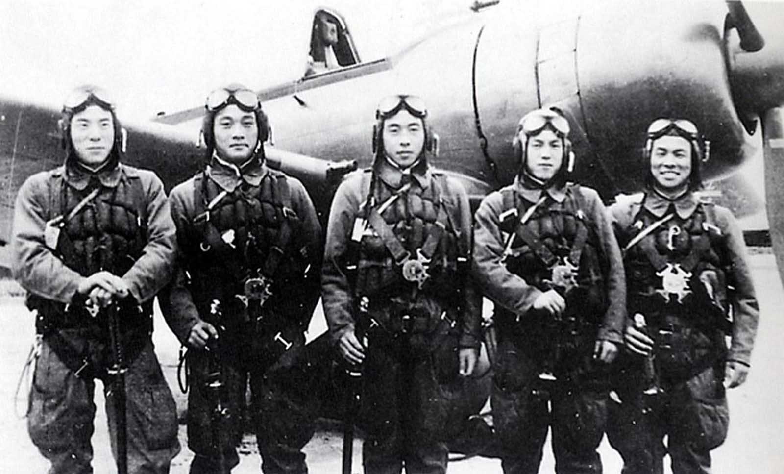 This photo provided by former Kamikaze pilot Toshio Yoshitake, shows Yoshitake, right, and his fellow pilots, from left, Tetsuya Ueno, Koshiro Hayashi, Naoki Okagami and Takao Oi, as they pose together in front of a Zero fighter plane before taking off from the Imperial Army airstrip in Choshi, just east of Tokyo, on November 8, 1944. None of the 17 other pilots and flight instructors who flew with Yoshitake on that day survived. Yoshitake only survived because an American warplane shot him out of the air, he crash-landed and was rescued by Japanese soldiers.