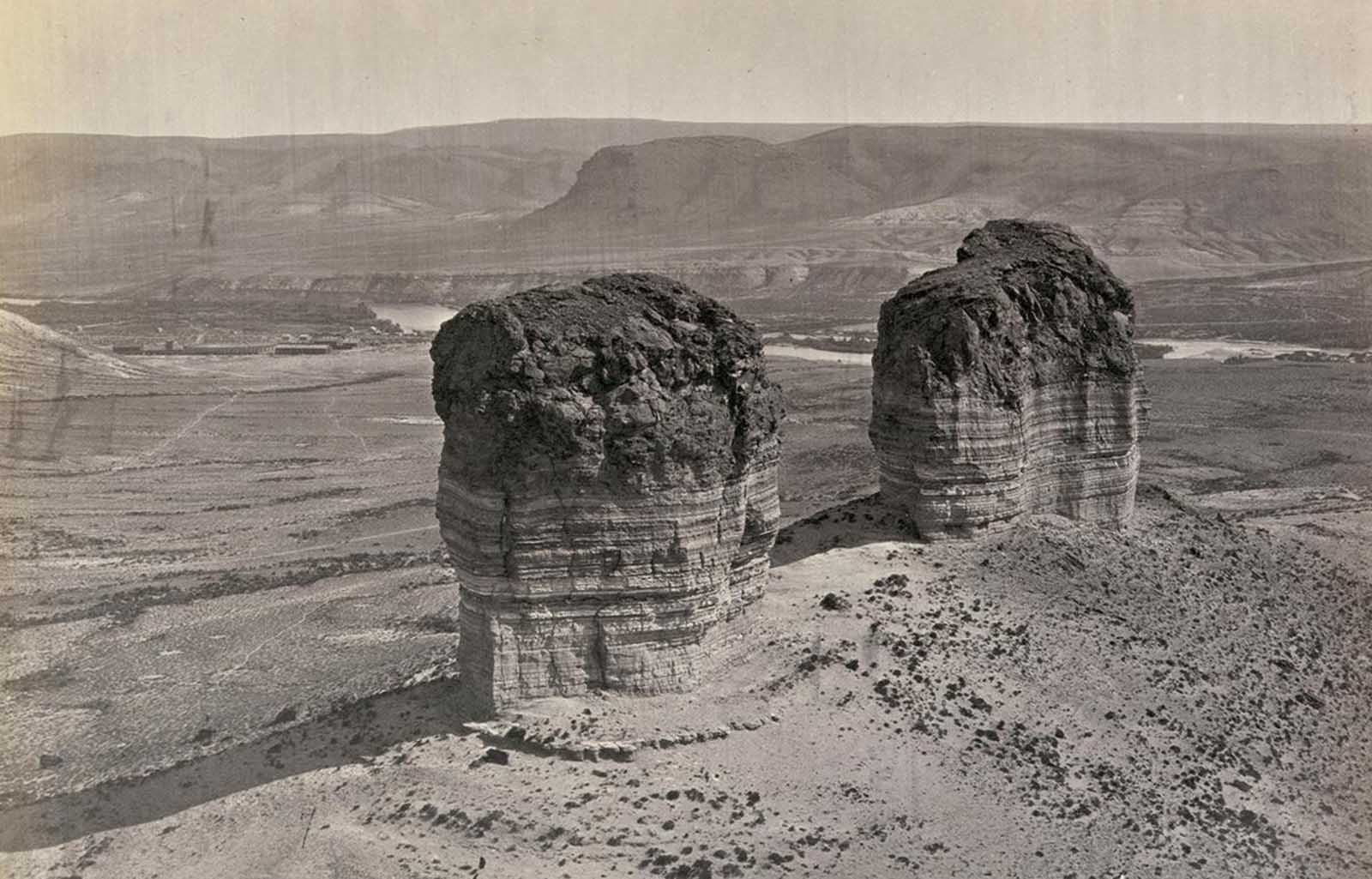Twin buttes stand near Green River City, Wyoming, photographed in 1872.