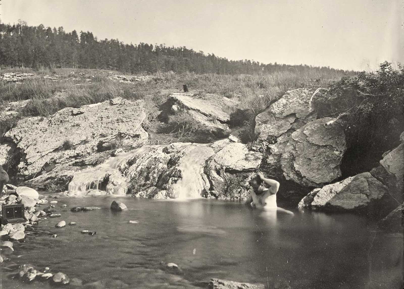 Man bathing in Pagosa Hot Spring, Colorado, in 1874.
