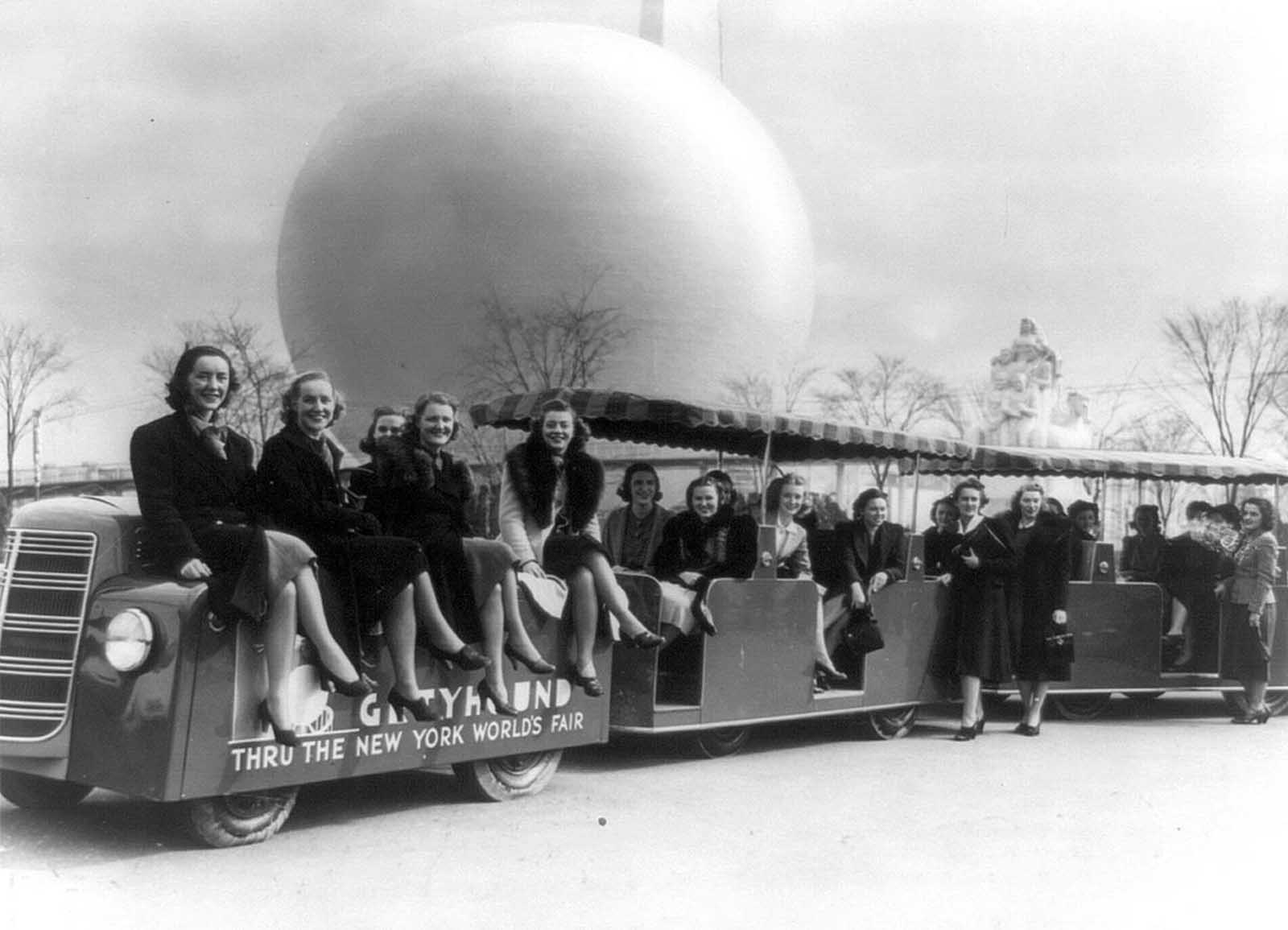 Members of the New York World's Fair staff, on a tractor train in 1939.