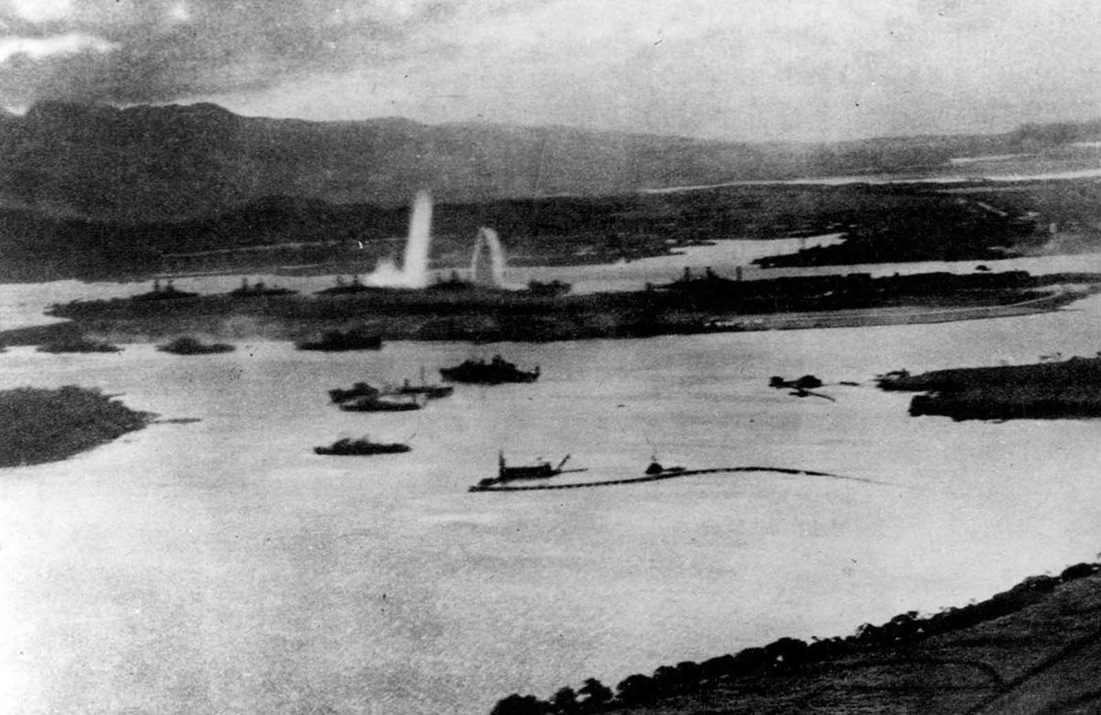 Aerial view of the initial blows struck against American ships, as seen from a Japanese plane over Pearl Harbor.
