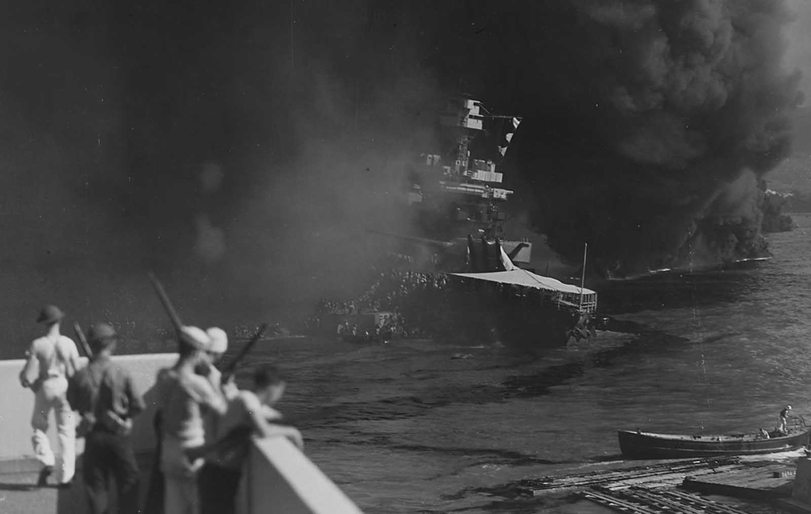 The USS California sinks into the mud of Pearl Harbor on December 7, 1941.