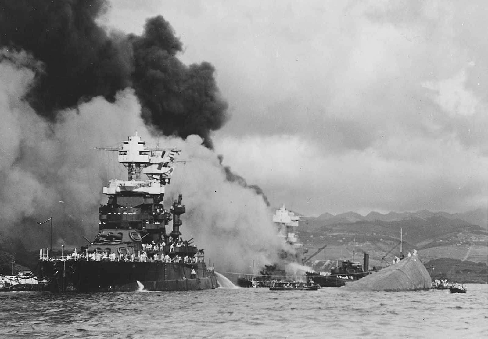 The USS Maryland, a battleship moored inboard of the USS Oklahoma, which capsized, was damaged slightly in the Japanese attack on Pearl Harbor on December 7, 1941.