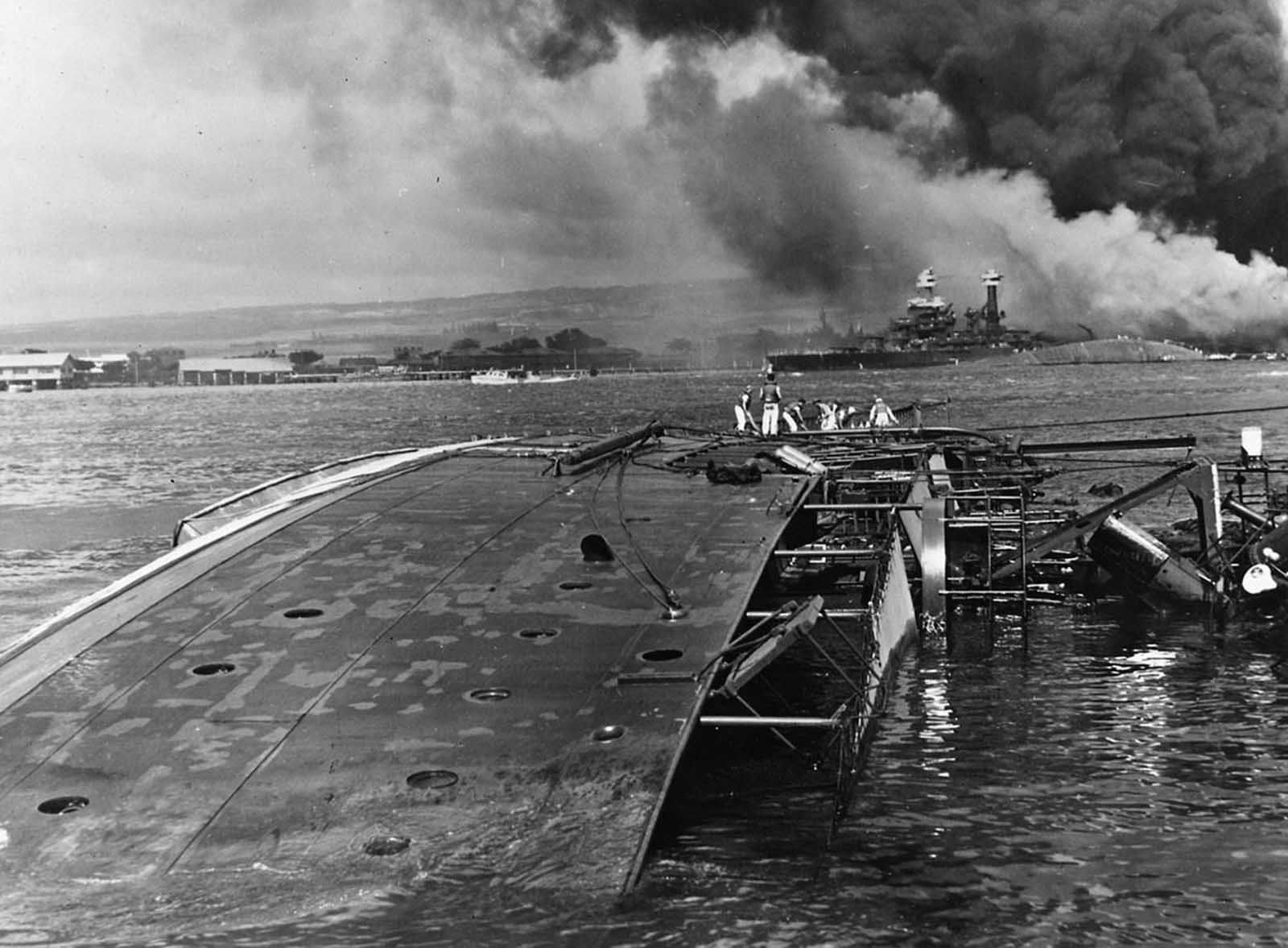 The minelayer USS Oglala lies capsized after being attacked by Japanese aircraft and submarines in the attack on Pearl Harbor.
