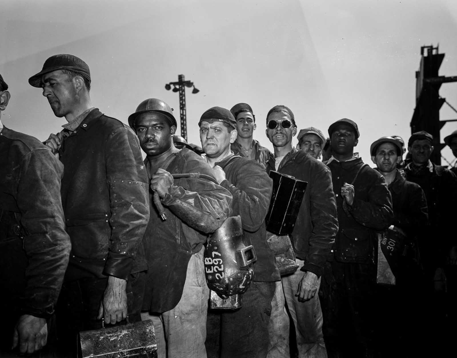 Workers on line to start their shift.