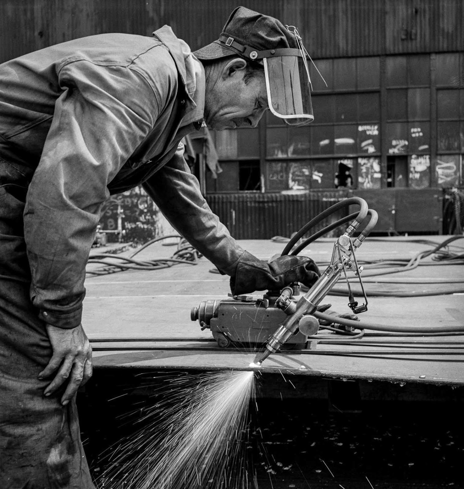 Burning off excess steel plate.