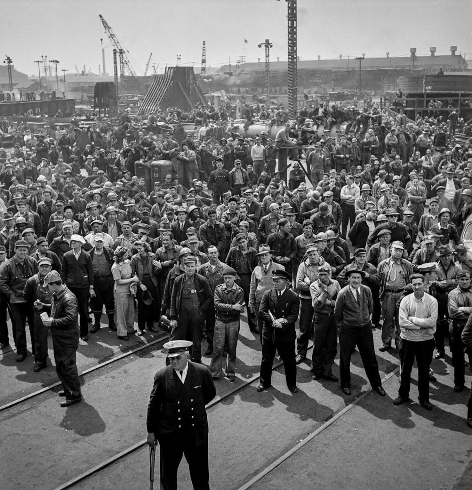 Workers gather for a ship launching ceremony.