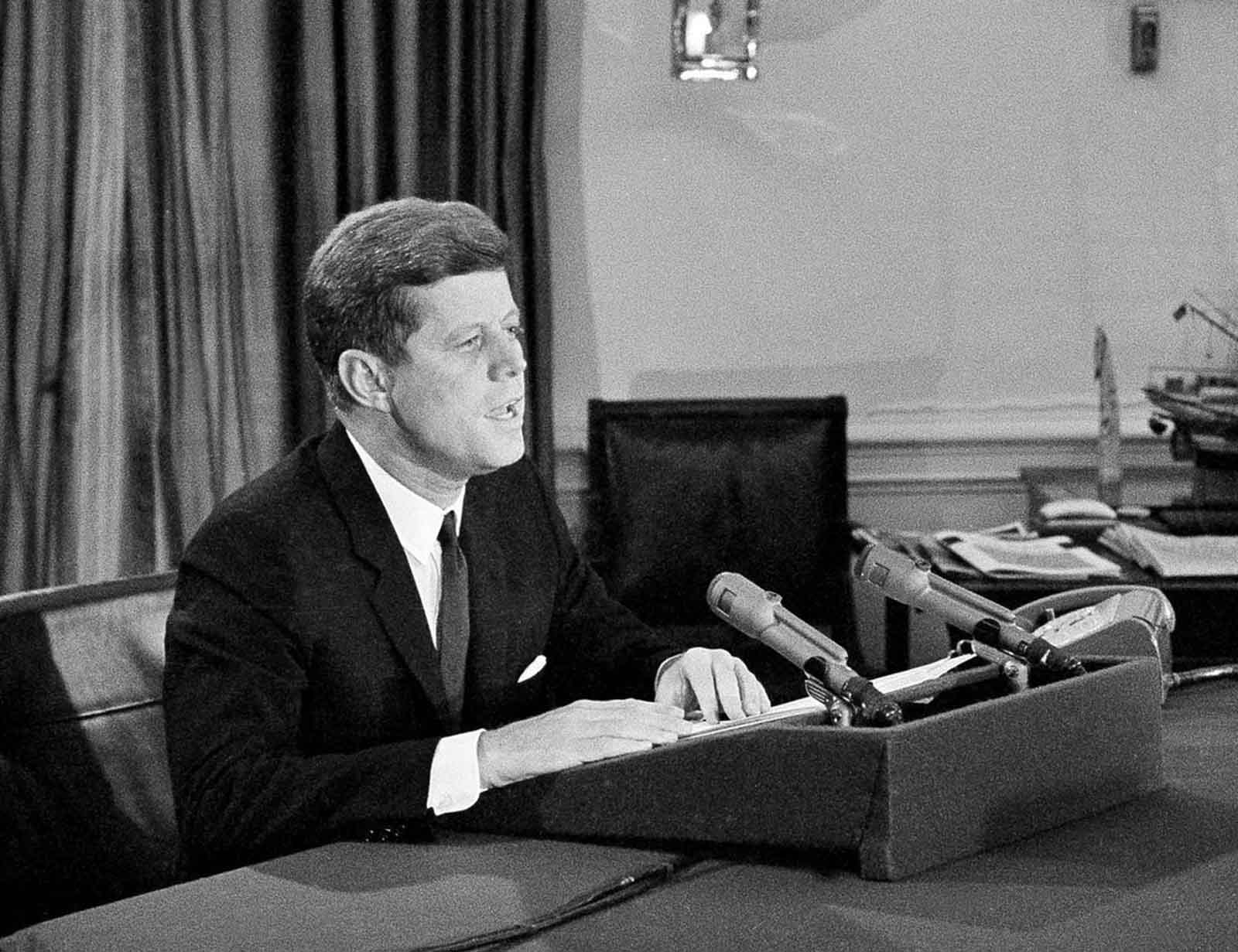 President John F. Kennedy tells the American people that the U.S. is setting up a naval blockade against Cuba, during a television and radio address, on October 22, 1962, from the White House. The president also said the U.S. would wreak