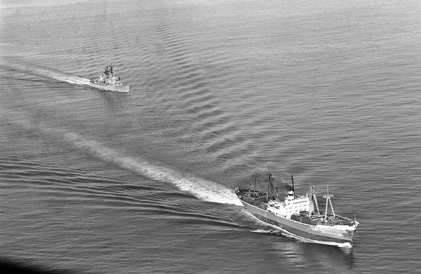 The U.S. Navy guided missile ship Dahlgren trails the Soviet Leninsky Komsomol as the Russian vessel departed Casilda, Cuba, on November 10, 1962.