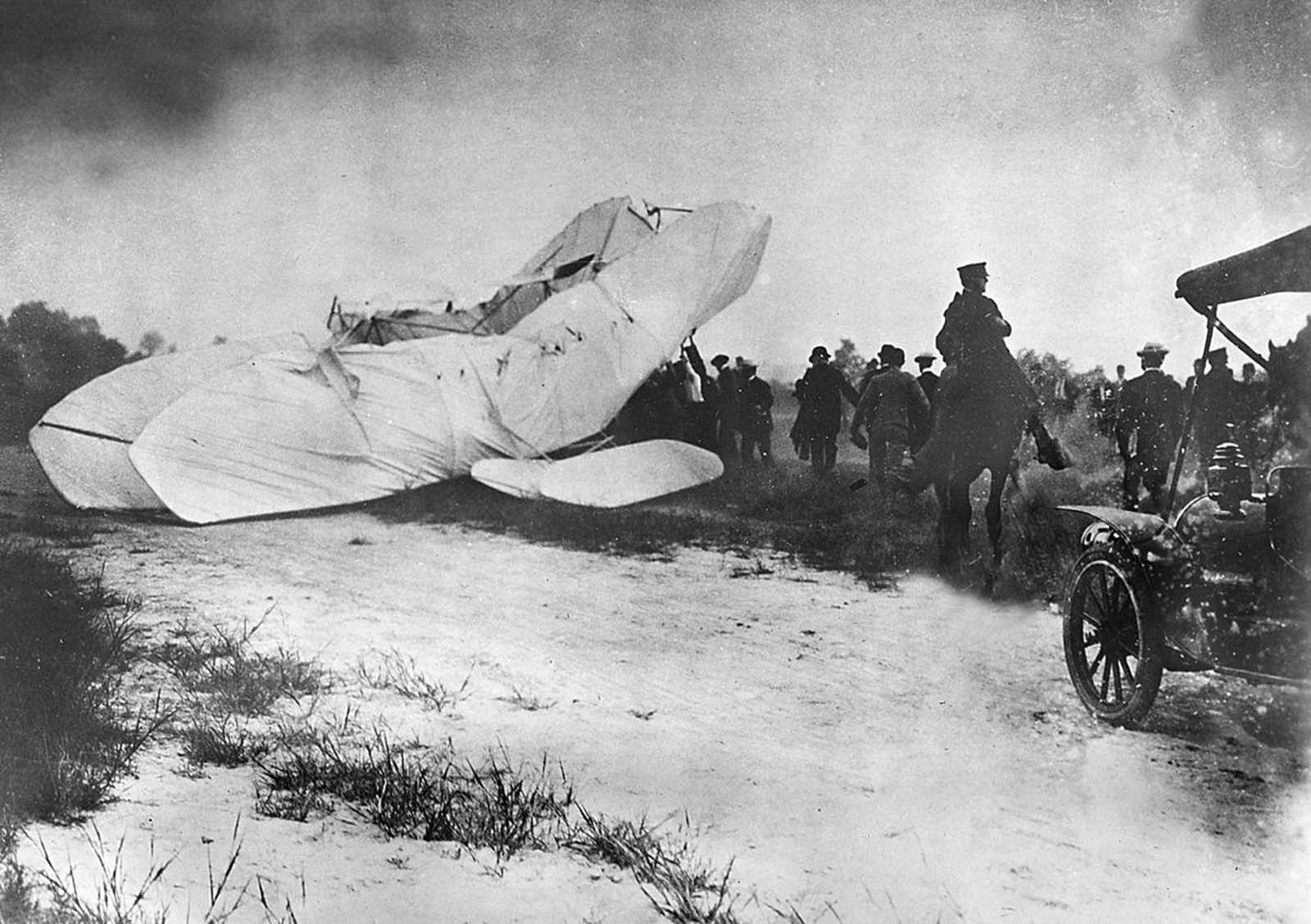 Troops of the U.S. Army Signal Corps rush to the site of a crashed plane to recover the pilot Orville Wright and his passenger, army observer Lieutenant Thomas E. Selfridge, from the wreckage on September 17, 1908, in Fort Myer, Virginia. The plane crashed during a demonstration flight at a military installation, making Lt. Selfridge, who died from his injuries, the first fatality of a military airplane crash. Orville suffered a broken left leg and four broken ribs.