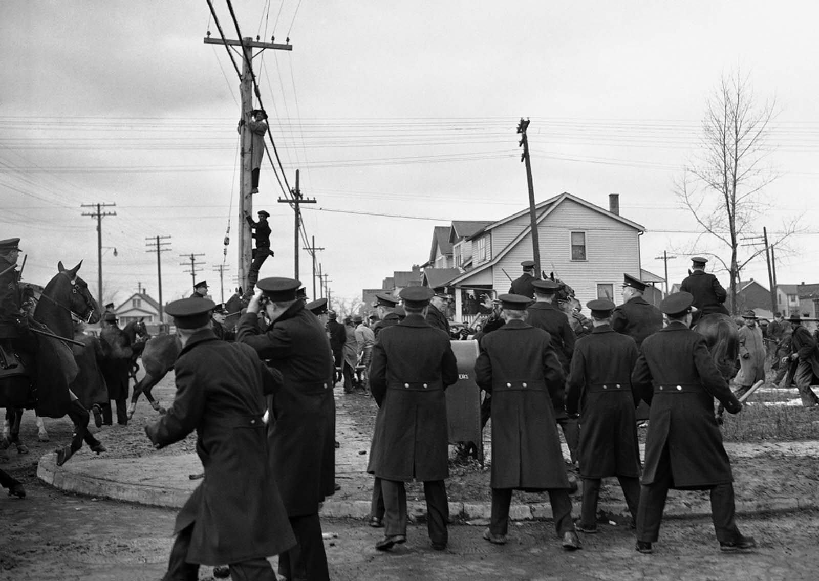 Stones flew despite a police riot squad's efforts to maintain order in Detroit, on February 28, 1942 between prospective Black tenants of a million-dollar defense housing project and white picketers who halted their moving vans. Several were hurt in the picket line skirmishes.