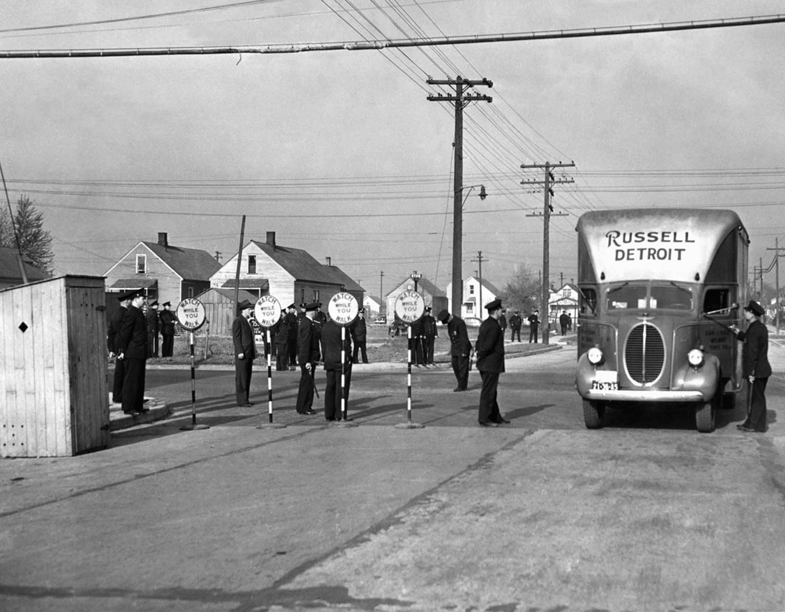 Guarded by more than 1,500 state troops, city and state police, moving vans carried the household goods of black families into Sojourners Truth, a federal housing project located in a white section of Detroit, on April 29, 1942. White protesters, whose previous attempts to prevent blacks from moving in ended in rioting, were dispersed.