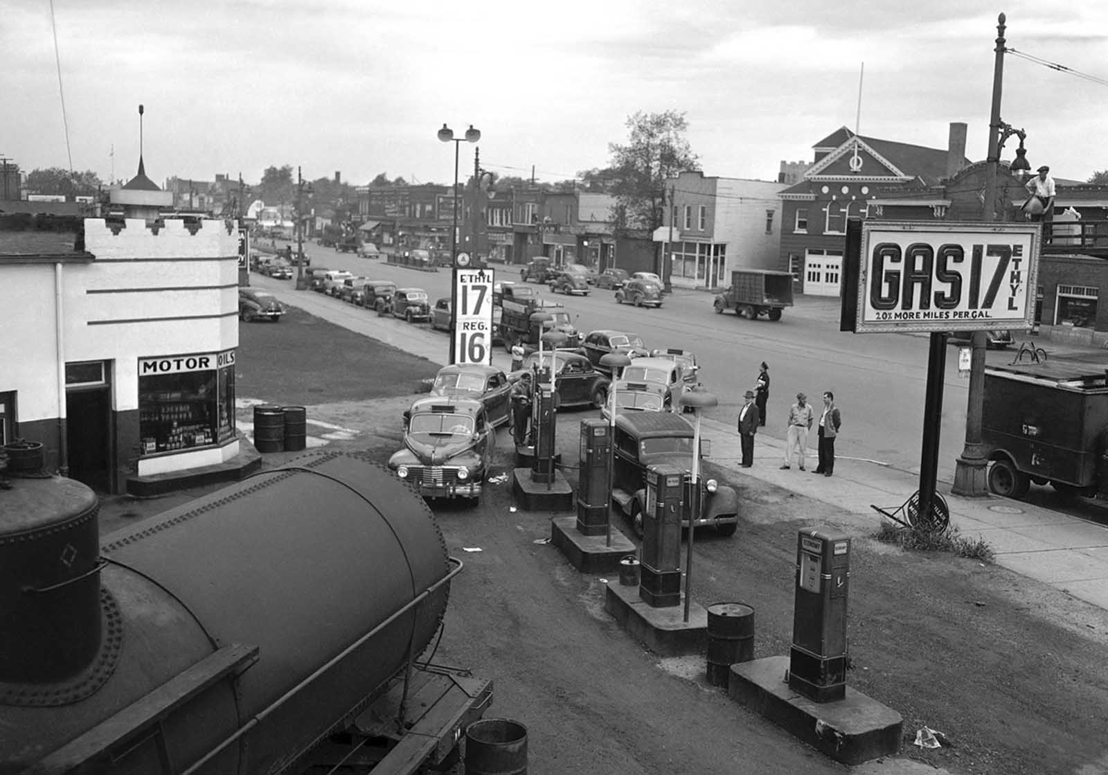 Motorists line a street waiting to buy gasoline at 17 cents per gallon at this station in Detroit on September 24, 1945. Such stations were not affected by a strike of Yank-Wacon truck drivers and did big business as nearly all other stations, supplied by truck, were closed.