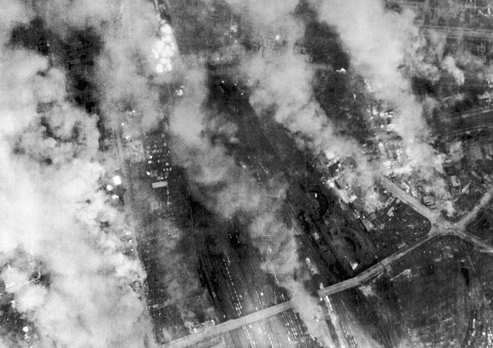 In this British Official Photo, on the night of February 13 and the morning of February 14, 1945, Lancasters of R.A.F. Bomber Command made two very heavy attacks on Dresden, Germany. Heavy bombers of the U.S. 8th Air Force attacked this target the following day. The smoke from fires still burning drifted across Dresden on February 14, 1945.
