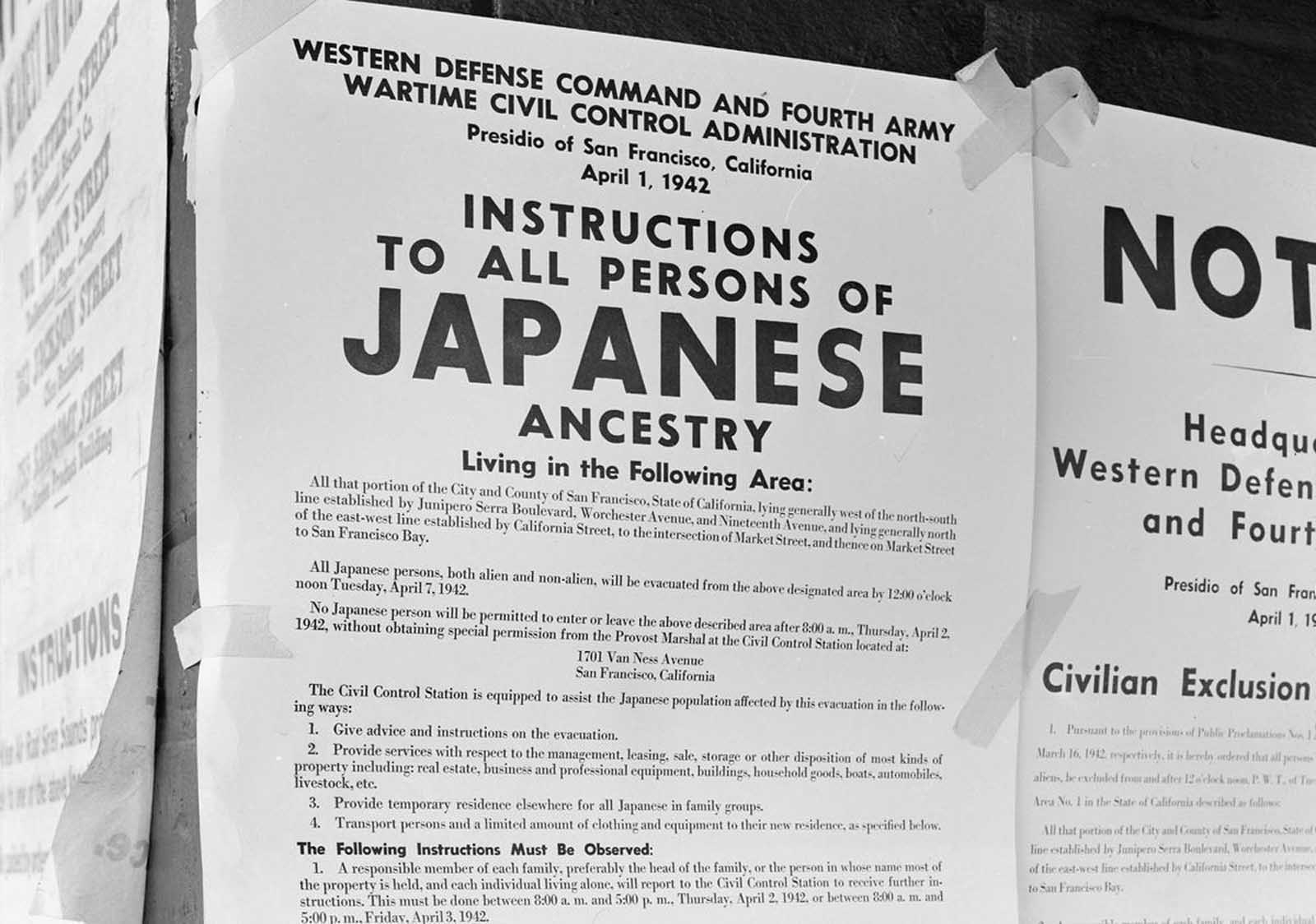 On a brick wall beside an air raid shelter poster, exclusion orders were posted at First and Front Streets in San Francisco, California, directing the removal of persons of Japanese ancestry from the first part of San Francisco to be affected by the evacuation. The order was issued April 1, 1942, by Lieutenant General J.L. DeWitt, and directed evacuation from this section by noon on April 7, 1942.