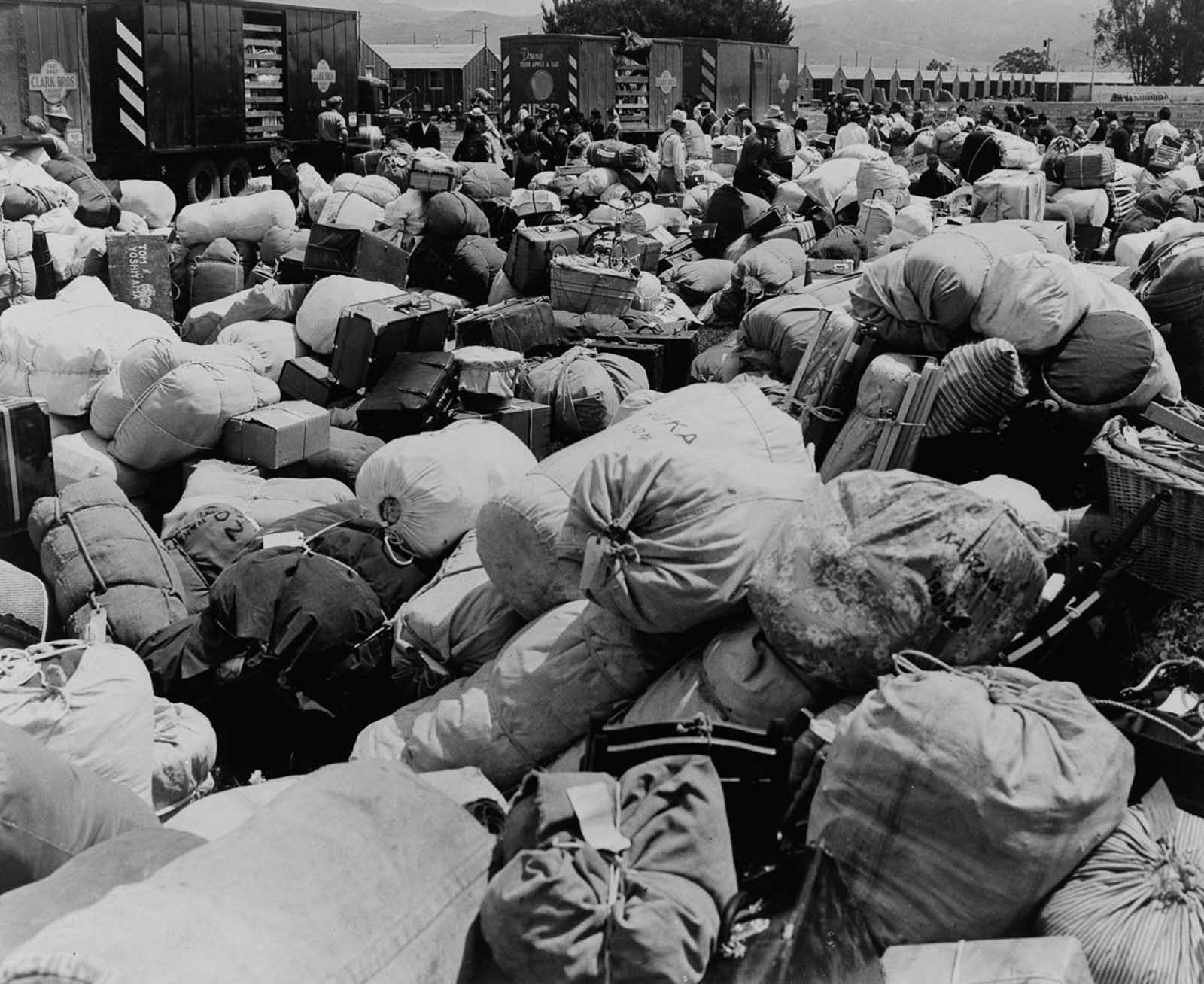Evacuees' baggage is piled up for transport at an assembly center in Salinas, California.