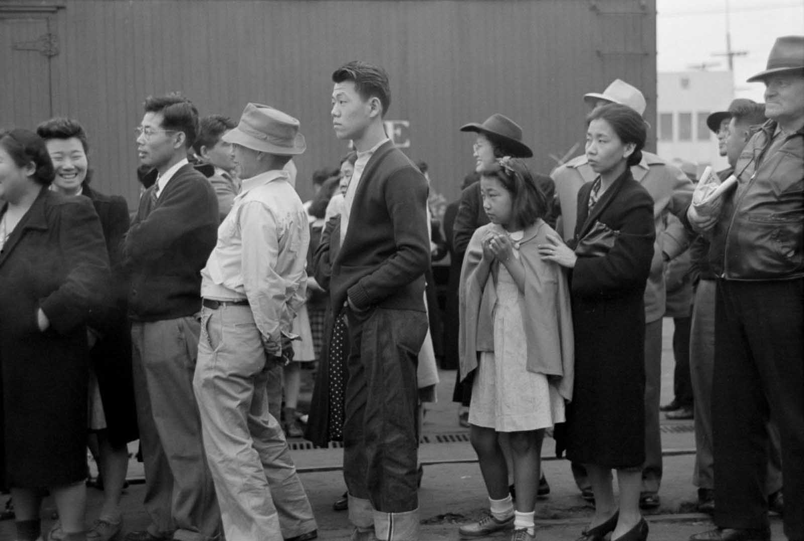 Evacuees in Los Angeles watch as trains carry their friends and relatives to Owens Valley.