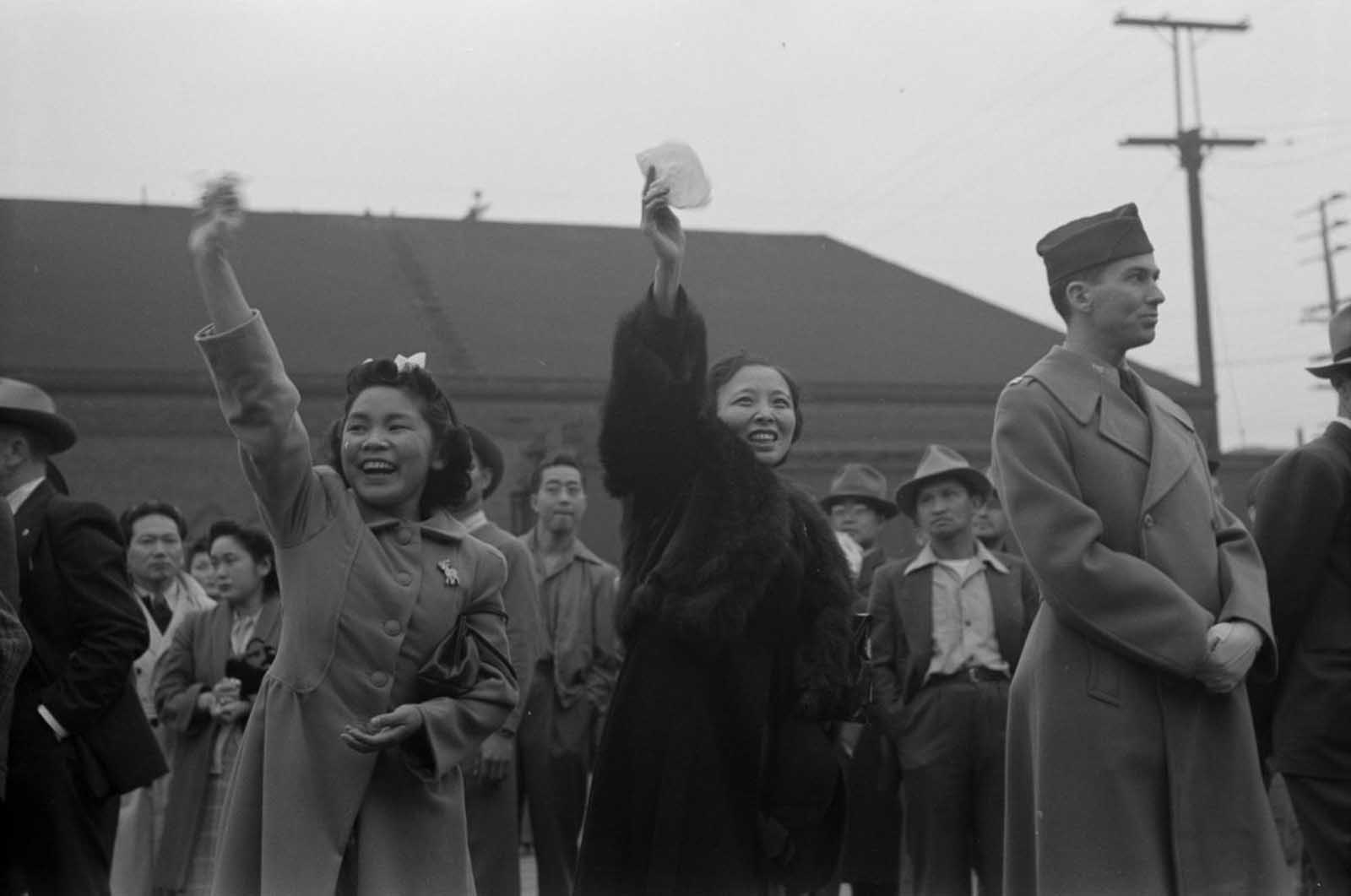 Evacuees wave goodbye to friends and relatives bound for Owens Valley.