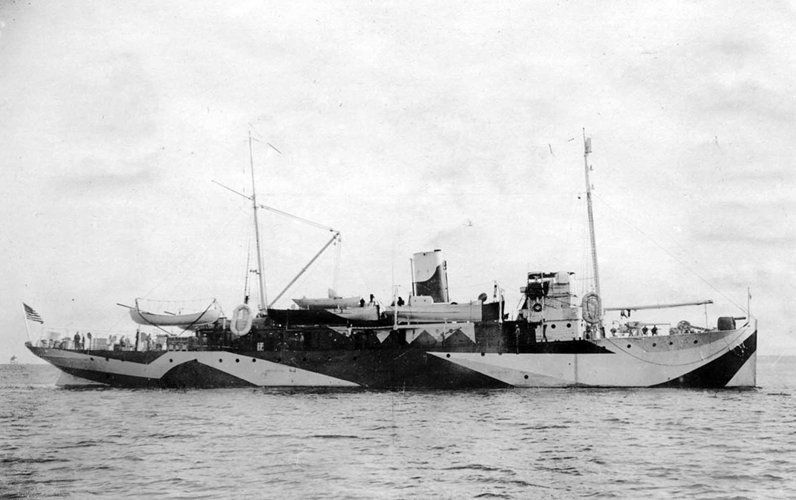 The USS Fulton (AS-1), an American submarine tender painted in Dazzle camouflage, in the Charleston South Carolina Navy Yard on November 1, 1918.