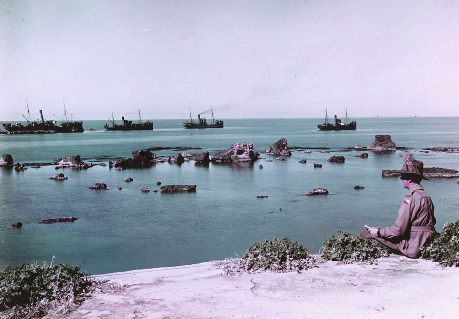 The Rocks of Andromeda, Jaffa, and transports laden with war supplies headed out to sea in 1918. This image was taken using the Paget process, an early experiment in color photography.