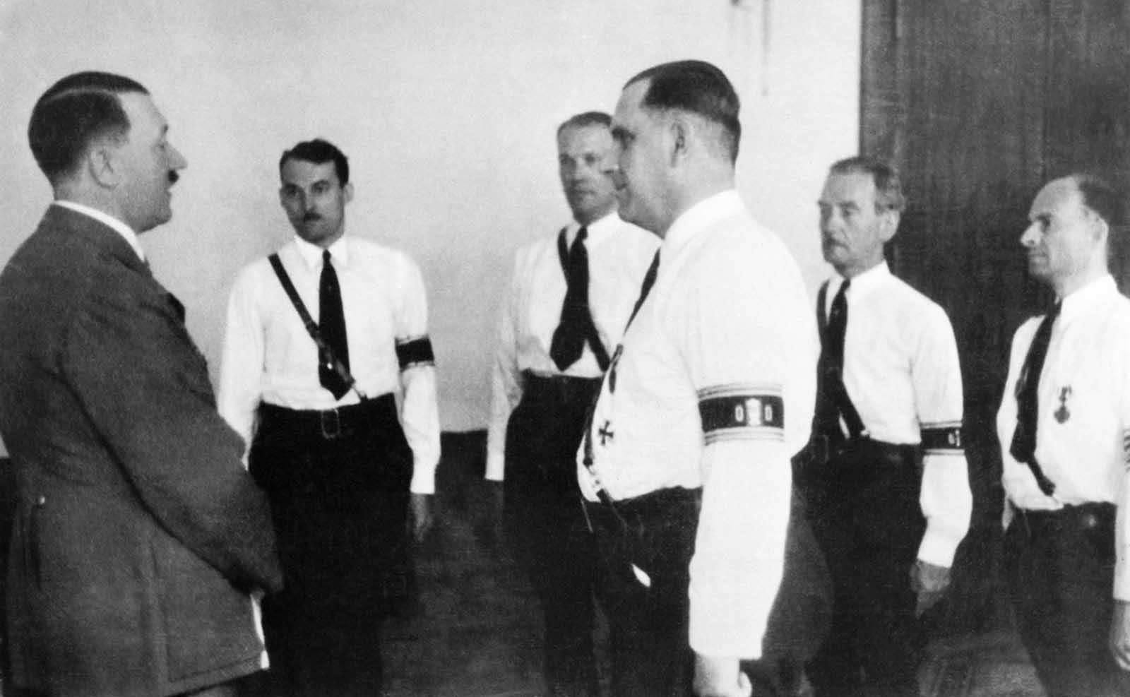 German American Bund leader Fritz Kuhn, (center, front), and members of his staff pay their respects to Germany's Chancellor Adolf Hitler, during a visit to Berlin.