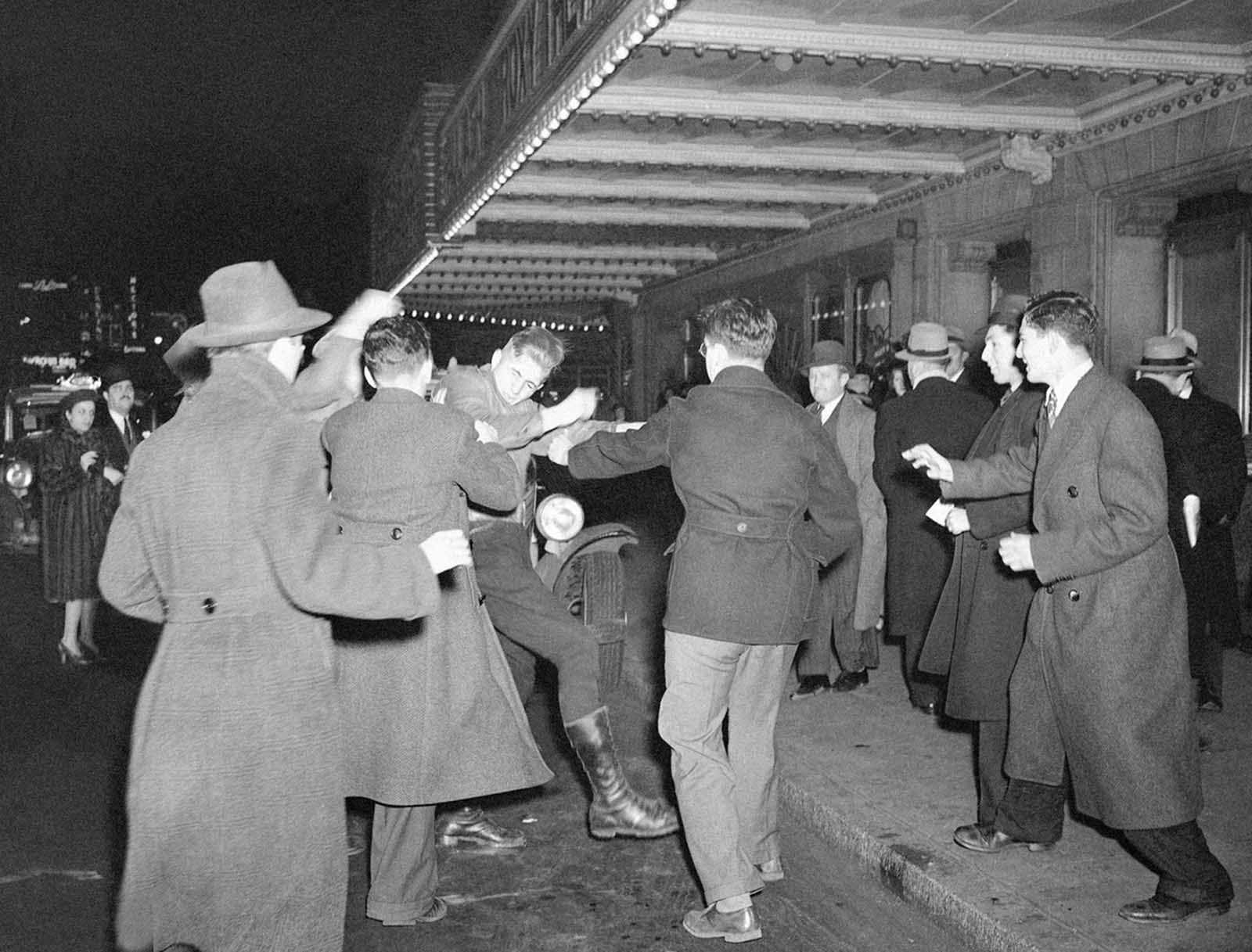 A crowd of demonstrators outside New York’s Madison Square Garden seize a uniformed member of the German American Bund who had emerged from a Bund rally in the Garden and attempted to enter a taxi, on February 20, 1939.
