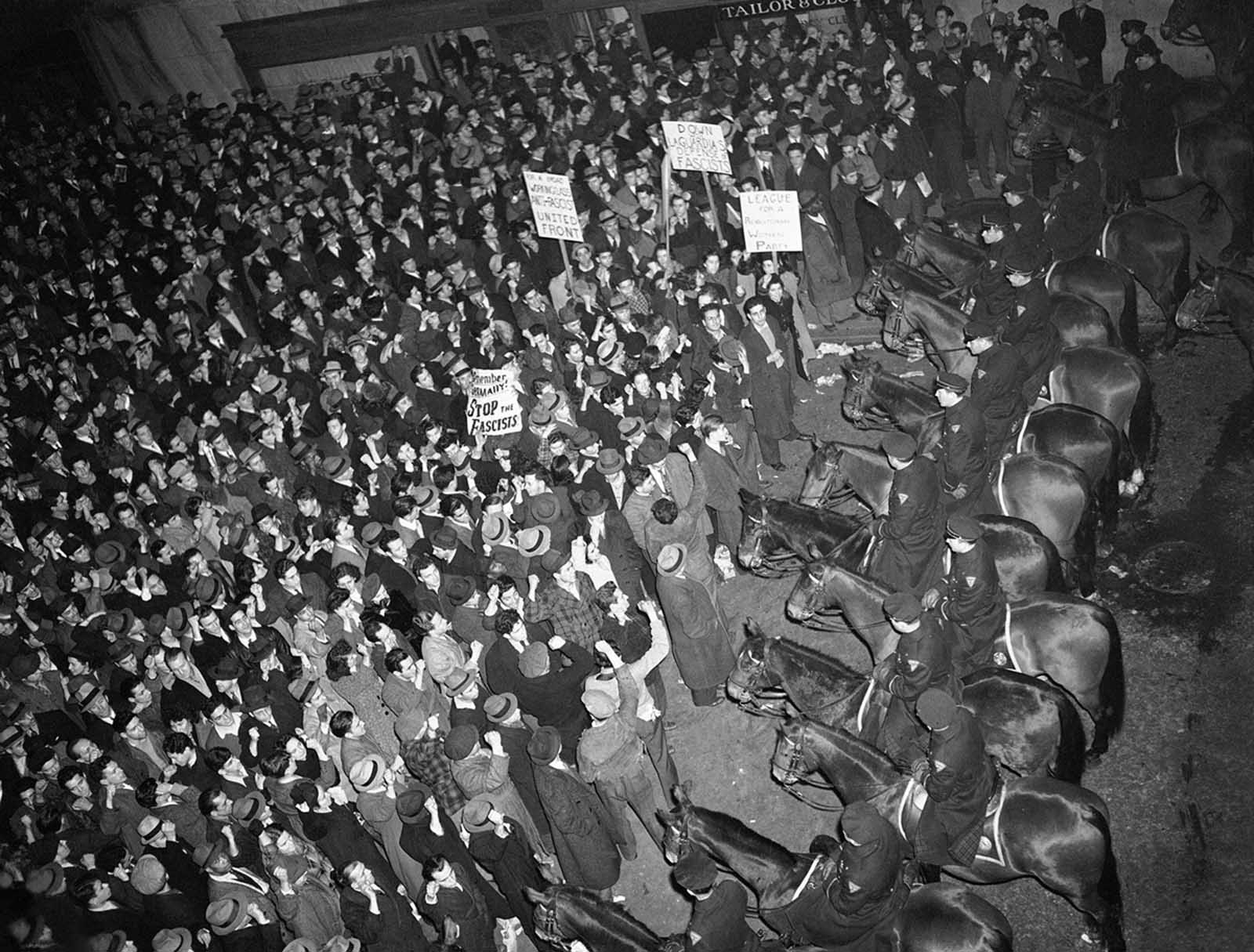 New York City’s mounted police form a solid line outside Madison Square Garden on February 20, 1939, to hold in check a crowd which packed the streets around the Garden where the German American Bund was holding a rally. To prevent any clash between bundsmen and counter-demonstrators, police surrounded the area with a force of 1,500.