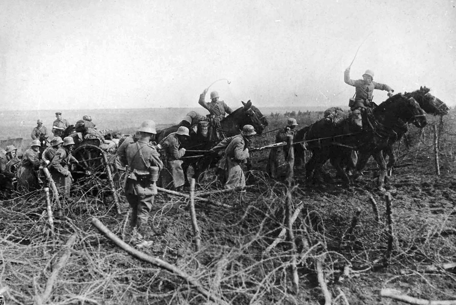 The breakthrough west of St. Quentin, Aisne, France. Artillery drawn by horses advances through captured British positions on March 26, 1918.