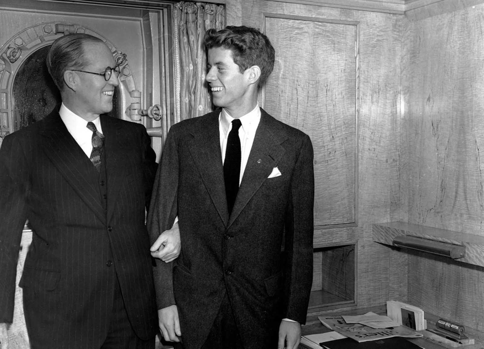In this January 5, 1938 file photo, Joseph P. Kennedy, left, U.S. Ambassador to Great Britain, stands with his 20 year old son, John F. Kennedy, in New York. Kennedy was the second son, and one of nine children, of business tycoon Joseph P. Kennedy. When first son Joseph Jr. was killed during World War II, John became the designated heir.