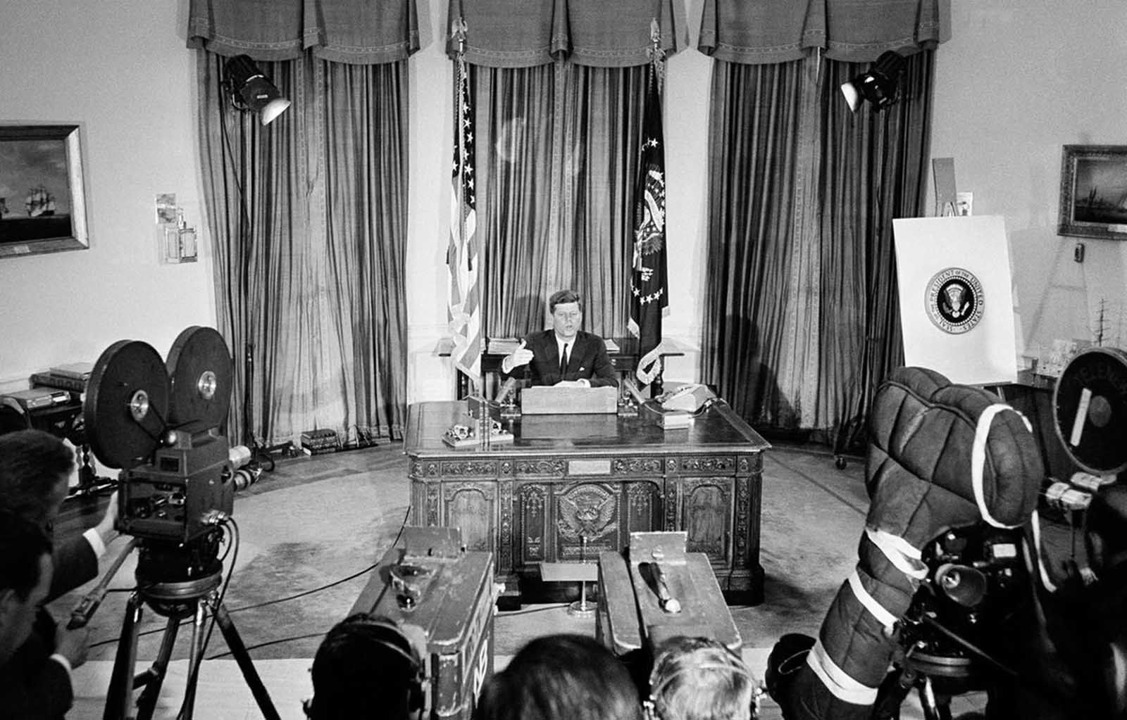 President Kennedy sits at his White House office desk, on June 6, 1961 as he reports to the nation by television and radio networks, on his talks with Soviet Premier Nikita Khrushchev in Vienna and President Charles de Gaulle of France in Paris.