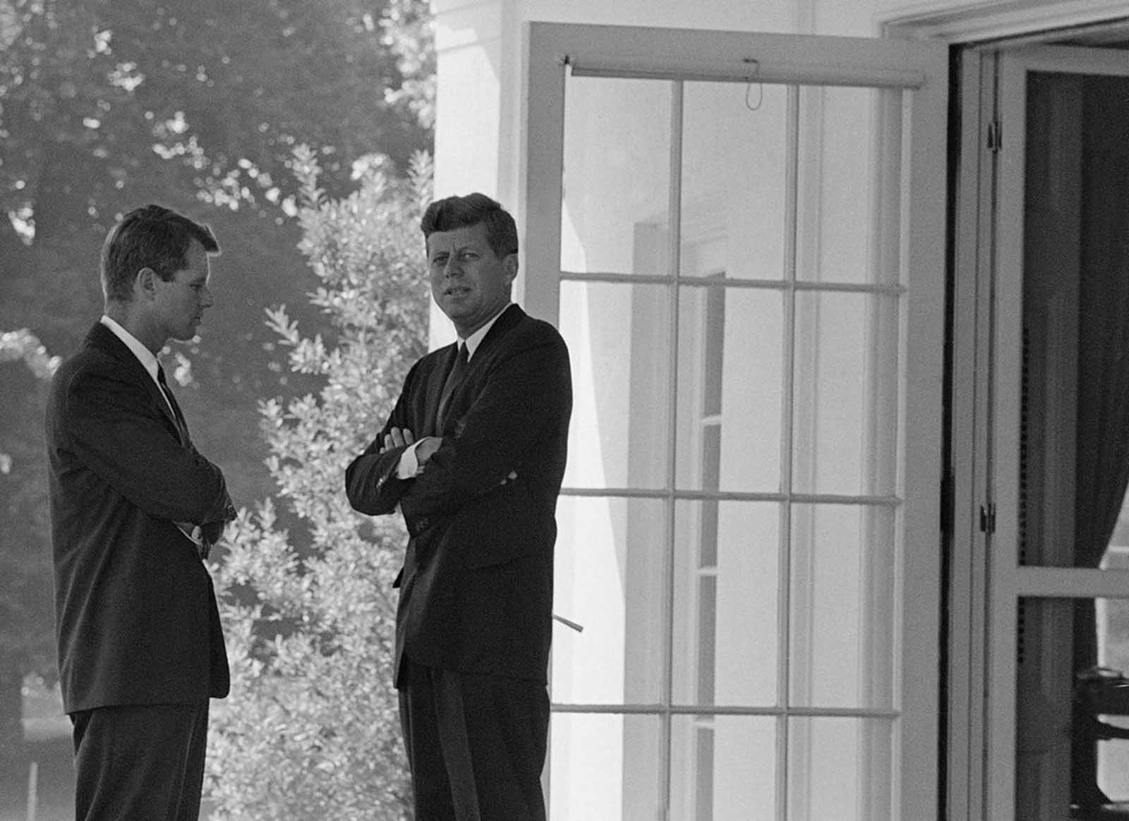 President Kennedy confers with his brother, Attorney General Robert F. Kennedy, at the White House in Washington, District of Columbia, on October 1, 1962 during the buildup of military tensions between the U.S. and the Soviet Union that became Cuban missile crisis later that month.