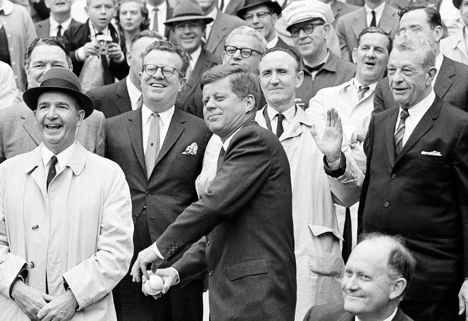 President Kennedy starts a windup for the pitch to open the American League baseball season, on April 8, 1962, in Washington.