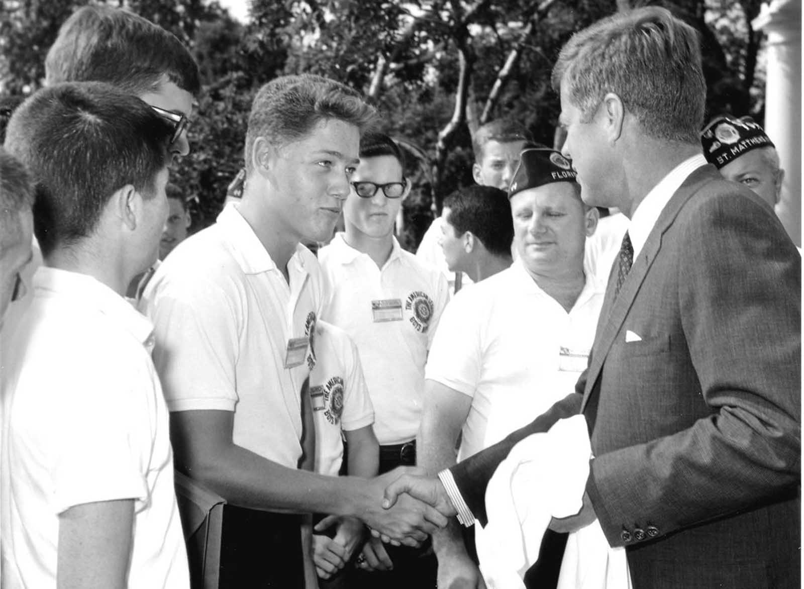 President Kennedy greets a 16-year-old Bill Clinton in the Rose garden of the White House at an American Legion Boys Nation event, on July 24, 1963.